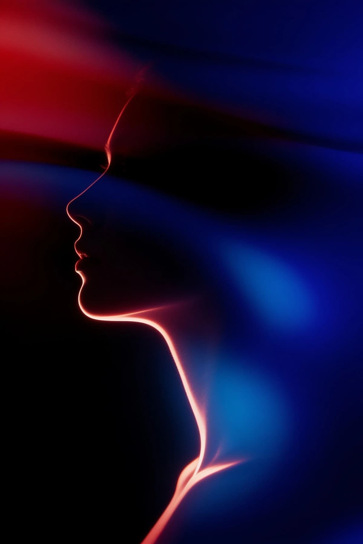 Abstract glowing profile of a face, jaw and neck, lit in red and blue